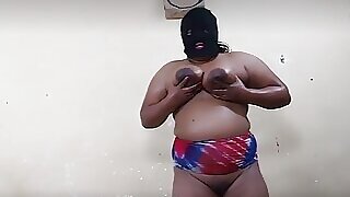 Monabhabhi doing coconut oil massage on her body by herself.
